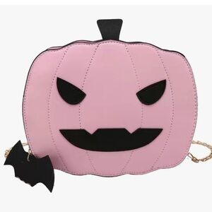 Jack-o’-lantern Crossbody vegan leather bag with chain. Zip closure on top. NWT